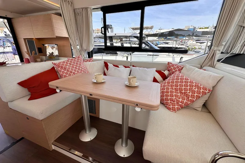  Yacht Photos Pics Luxurious interior of 2025 Beneteau Swift Trawler 41 Fly with cozy seating and cushions.