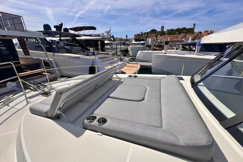  Yacht Photos Pics 2025 Beneteau Swift Trawler 41 Fly, docked with sunbathing area, in a marina setting.