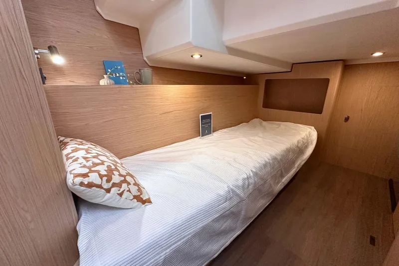  Yacht Photos Pics 2025 Beneteau Swift Trawler 41 Fly cabin with cozy bed and modern lighting.