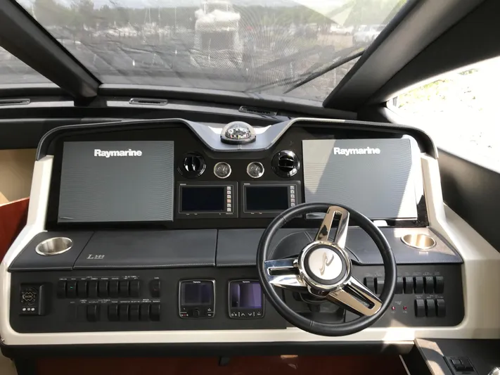 Forevermore Yacht Photos Pics Helm of 2016 Sea Ray L590 Fly yacht with Raymarine navigation systems.