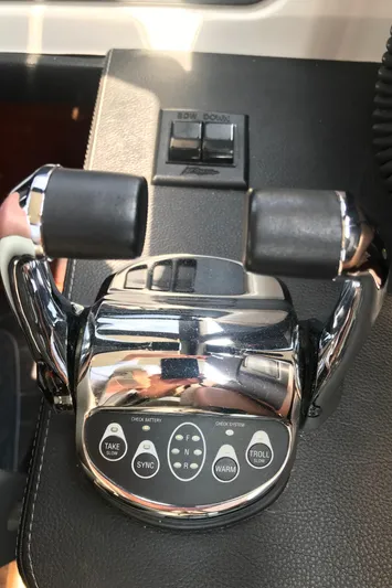 Forevermore Yacht Photos Pics Close-up of 2016 Sea Ray L590 Fly throttle controls on a sleek dashboard.