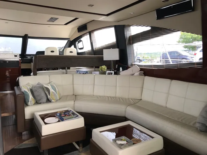 Forevermore Yacht Photos Pics Luxurious interior of 2016 Sea Ray L590 Fly yacht with plush seating and modern decor.