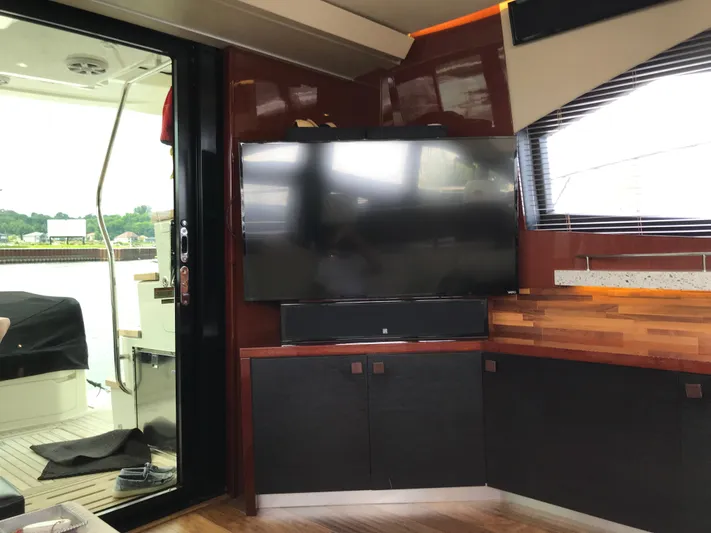Forevermore Yacht Photos Pics Interior of 2016 Sea Ray L590 Fly yacht with TV and modern furnishings.