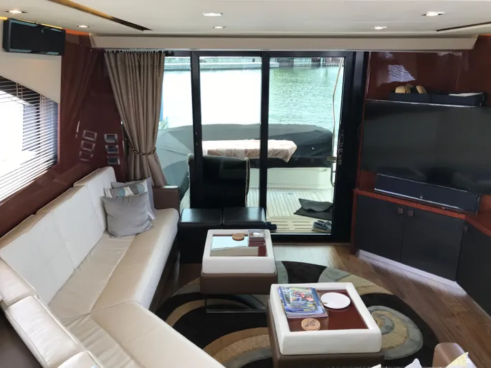 Forevermore Yacht Photos Pics Luxurious interior of 2016 Sea Ray L590 Fly yacht with modern furnishings and waterfront view.