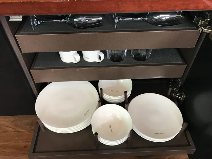 Forevermore Yacht Photos Pics Cabinet with neatly arranged dishes and glassware on a 2016 Sea Ray L590 Fly yacht.