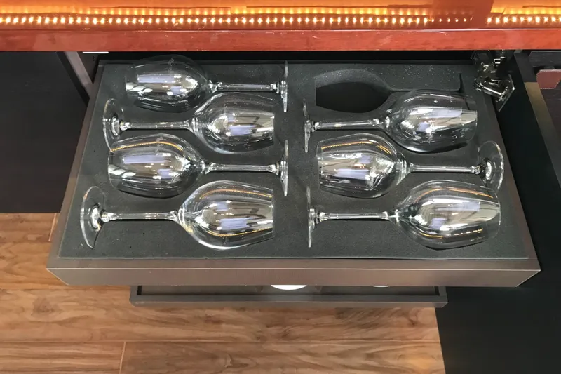 Forevermore Yacht Photos Pics Wine glasses in a drawer on a 2016 Sea Ray L590 Fly yacht.
