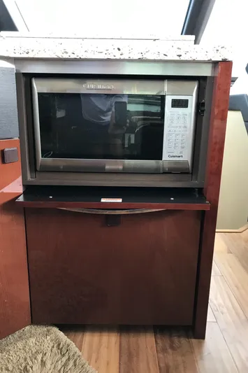 Forevermore Yacht Photos Pics Microwave in 2016 Sea Ray L590 Fly yacht kitchen with wooden cabinetry.