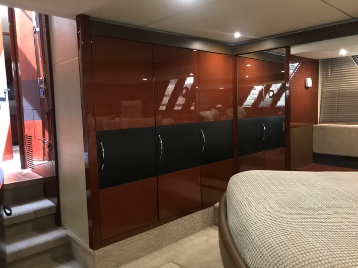 Forevermore Yacht Photos Pics Luxurious interior of 2016 Sea Ray L590 Fly yacht with sleek cabinetry and cozy bedroom.