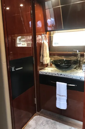 Forevermore Yacht Photos Pics Luxurious bathroom interior of 2016 Sea Ray L590 Fly yacht with modern fixtures.