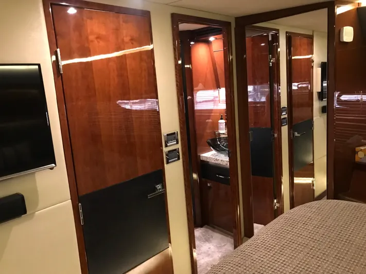 Forevermore Yacht Photos Pics Luxurious interior of 2016 Sea Ray L590 Fly yacht with polished wood finishes and modern amenities.