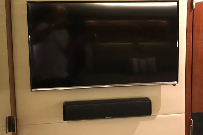 Forevermore Yacht Photos Pics Flat-screen TV and soundbar in 2016 Sea Ray L590 Fly yacht interior.