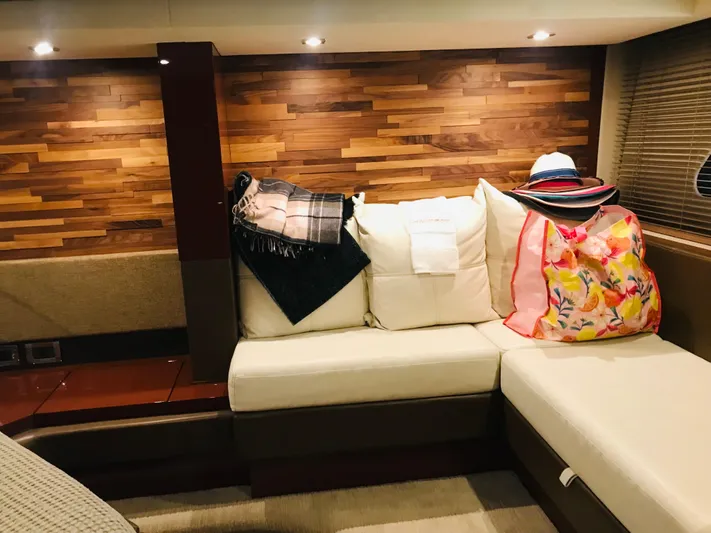 Forevermore Yacht Photos Pics Luxurious interior of 2016 Sea Ray L590 Fly yacht with cozy seating and stylish decor.