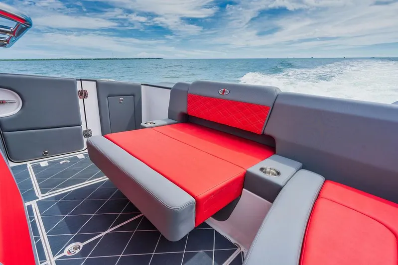 Incognito Yacht Photos Pics 2022 Cigarette 42 Nighteagle boat interior with red and gray seating, ocean view.