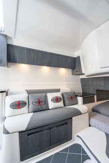Incognito Yacht Photos Pics Luxurious interior of 2022 Cigarette 42 Nighteagle boat with modern seating and lighting.
