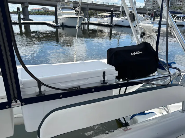 Making Memorie's Yacht Photos Pics Sailboat deck with cooler and grill, docked at marina. Manta 40, 1999 model.