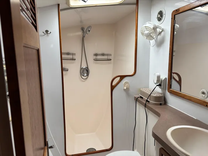 Making Memorie's Yacht Photos Pics Bathroom interior of a 1999 Manta 40 yacht with shower and sink.