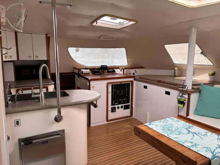 Making Memorie's Yacht Photos Pics Interior of 1999 Manta 40 yacht with modern kitchen and seating area.