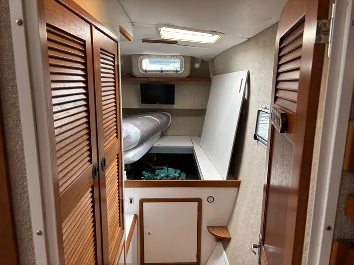 Making Memorie's Yacht Photos Pics 1999 Manta 40 interior cabin with wooden doors and engine compartment.
