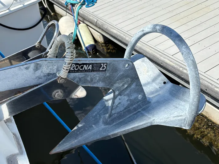 Making Memorie's Yacht Photos Pics Rocna 25 anchor on a 1999 Manta 40 sailboat, docked at a marina.