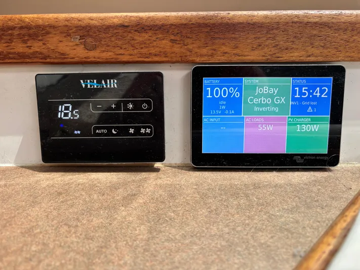 Making Memorie's Yacht Photos Pics Digital control panels on a 1999 Manta 40, displaying temperature and energy system status.