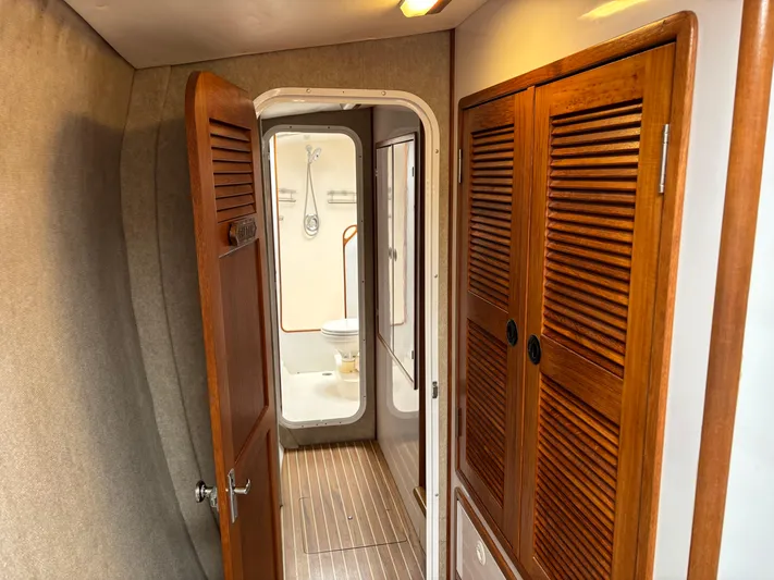 Making Memorie's Yacht Photos Pics Interior of 1999 Manta 40 yacht with wooden doors and bathroom view.