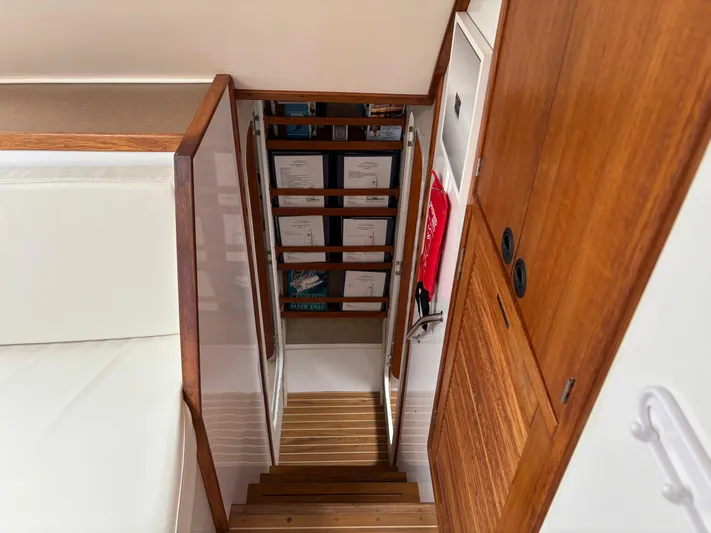 Making Memorie's Yacht Photos Pics Interior of 1999 Manta 40 yacht with wooden stairs and storage shelves.