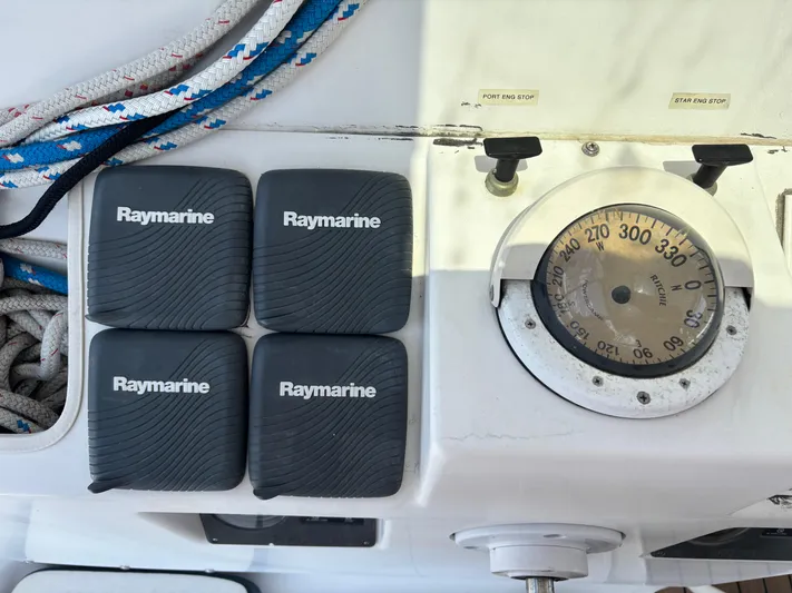 Making Memorie's Yacht Photos Pics Control panel of a 1999 Manta 40 with Raymarine covers and compass.