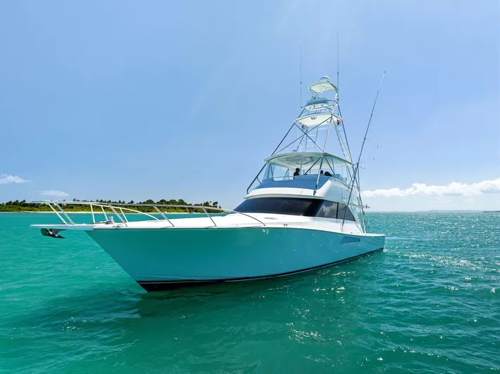 Ivelymar Yacht Photos Pics 2005 Viking 56 Convertible yacht on turquoise ocean under clear blue sky.