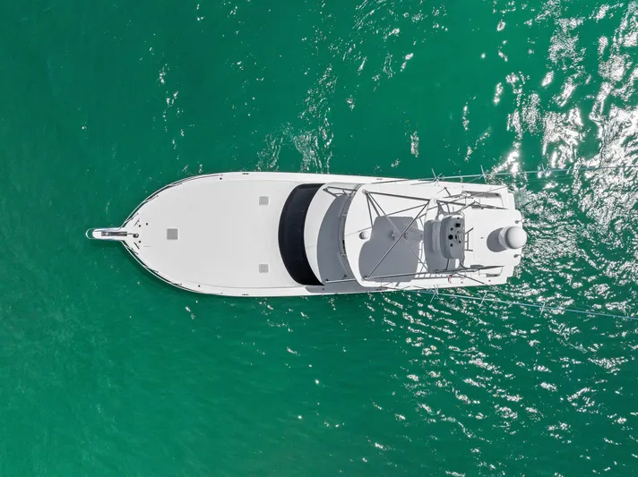 Ivelymar Yacht Photos Pics Aerial view of 2005 Viking 56 Convertible yacht on turquoise water.