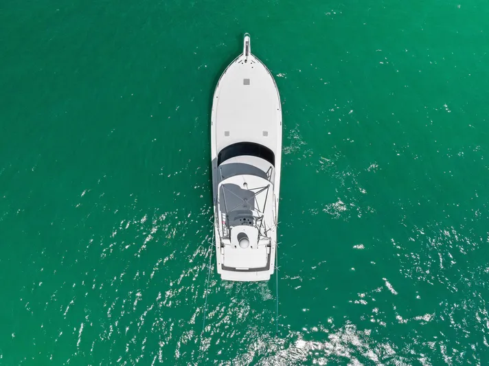 Ivelymar Yacht Photos Pics Aerial view of 2005 Viking 56 Convertible yacht on turquoise water.