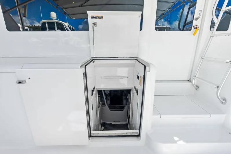 Ivelymar Yacht Photos Pics 2005 Viking 56 Convertible yacht interior with open hatch and storage compartments.