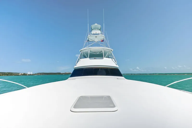 Ivelymar Yacht Photos Pics 2005 Viking 56 Convertible yacht on open sea, clear blue sky.