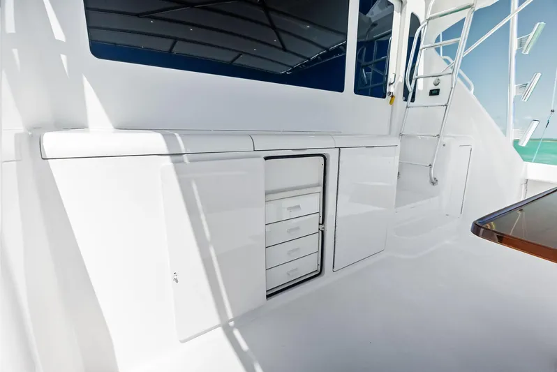 Ivelymar Yacht Photos Pics 2005 Viking 56 Convertible yacht deck with storage cabinets and stairs.