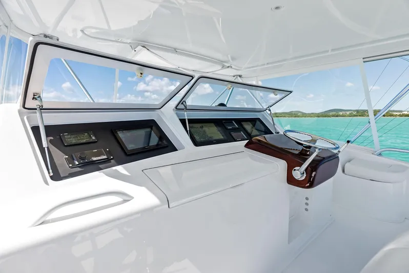 Ivelymar Yacht Photos Pics 2005 Viking 56 Convertible yacht helm with ocean view and modern controls.