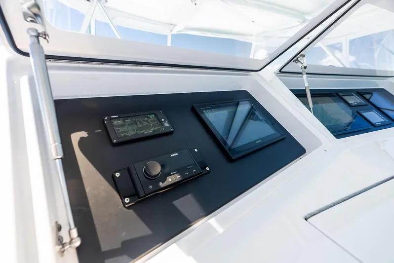 Ivelymar Yacht Photos Pics Control panel of 2005 Viking 56 Convertible yacht with navigation instruments.