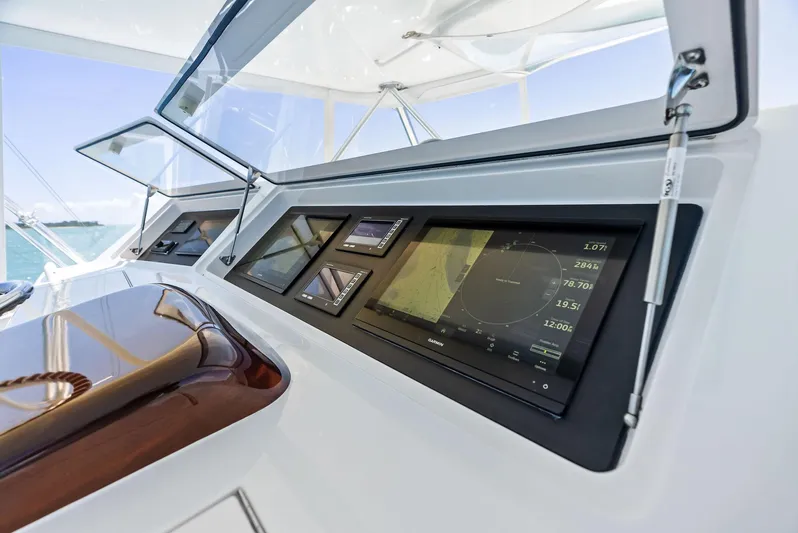 Ivelymar Yacht Photos Pics Control panel of 2005 Viking 56 Convertible yacht with navigation displays.