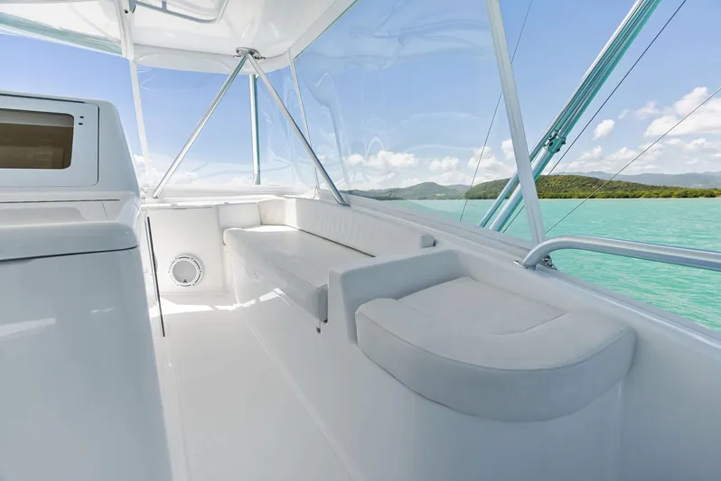 Ivelymar Yacht Photos Pics 2005 Viking 56 Convertible yacht interior with white seating and ocean view.