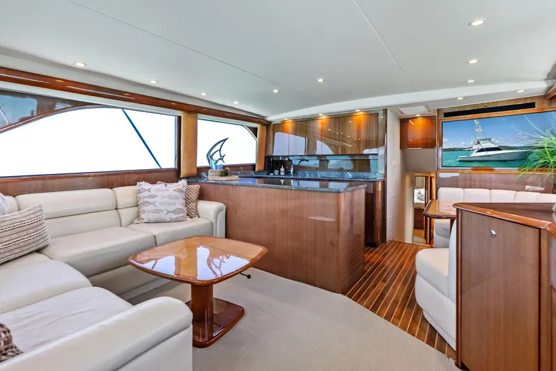 Ivelymar Yacht Photos Pics Luxurious interior of 2005 Viking 56 Convertible yacht with elegant seating and wooden finishes.