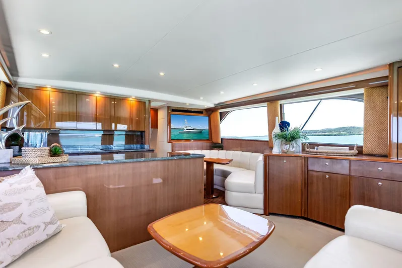 Ivelymar Yacht Photos Pics Luxurious interior of 2005 Viking 56 Convertible yacht with elegant wood finishes.