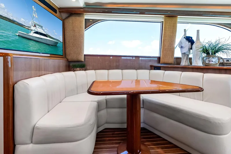 Ivelymar Yacht Photos Pics Luxurious interior of 2005 Viking 56 Convertible yacht with plush seating and elegant decor.