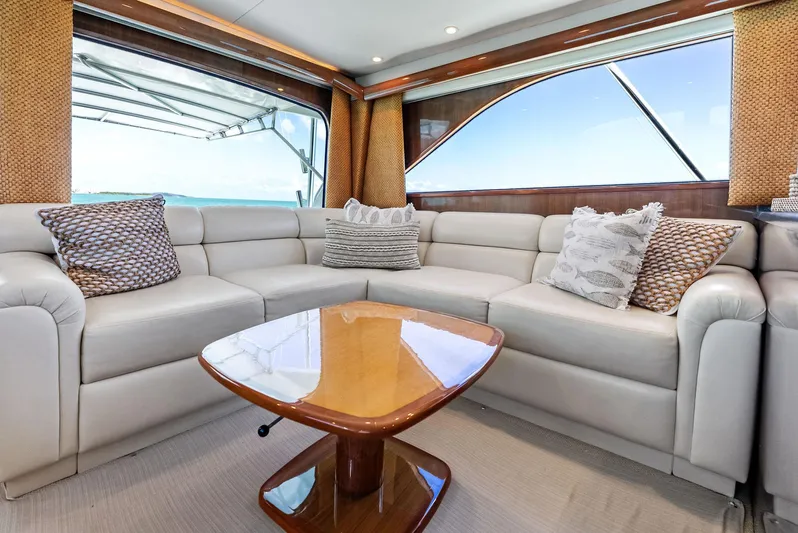 Ivelymar Yacht Photos Pics Luxurious interior of 2005 Viking 56 Convertible yacht with plush seating and elegant decor.