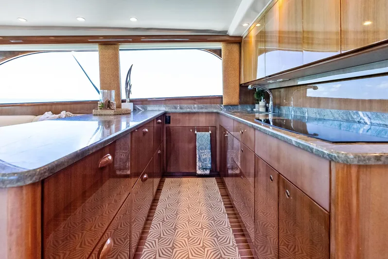 Ivelymar Yacht Photos Pics Luxurious interior of 2005 Viking 56 Convertible yacht with elegant wood cabinetry.