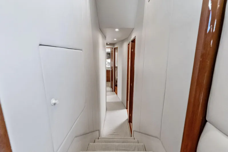 Ivelymar Yacht Photos Pics Interior hallway of 2005 Viking 56 Convertible yacht with wooden accents.