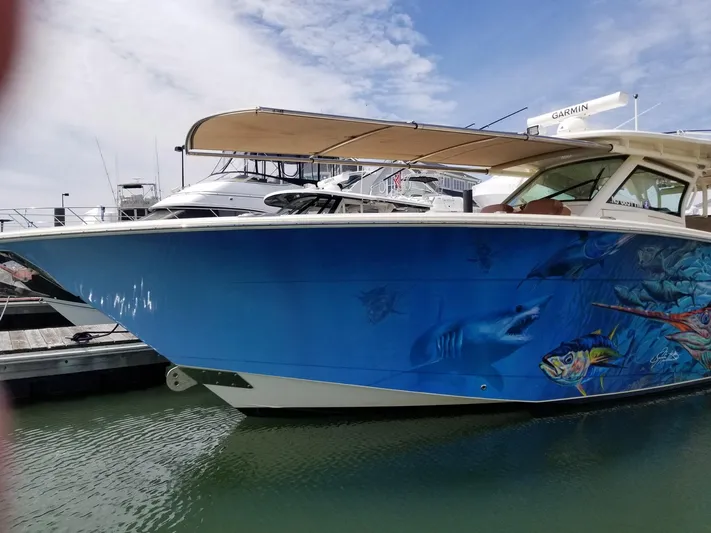 Shady Lady II Yacht Photos Pics 2019 Scout 380 LXF boat with vibrant marine-themed hull artwork docked at marina.