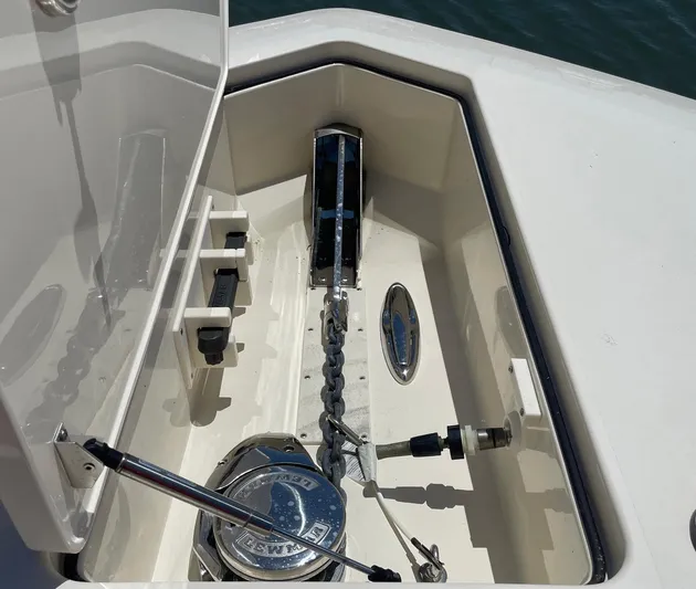 Shady Lady II Yacht Photos Pics Anchor compartment of 2019 Scout 380 LXF boat, featuring chain and winch.