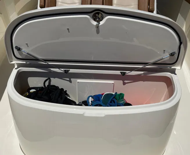 Shady Lady II Yacht Photos Pics Open storage compartment on 2019 Scout 380 LXF boat with ropes and gear inside.