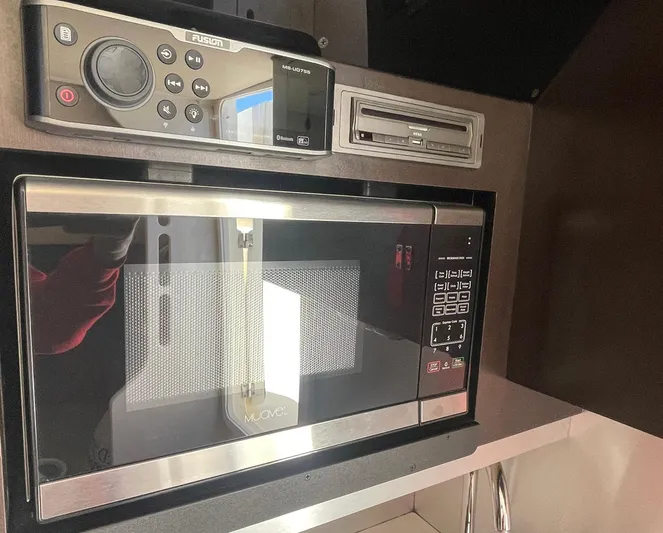 Shady Lady II Yacht Photos Pics Microwave and audio system inside 2019 Scout 380 LXF boat interior.