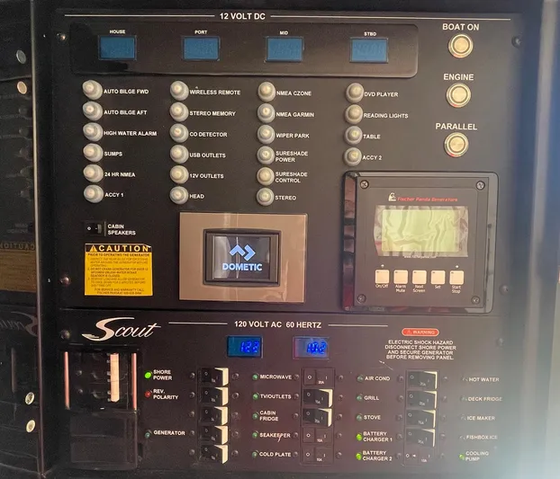 Shady Lady II Yacht Photos Pics Control panel of a 2019 Scout 380 LXF boat with various switches and displays.