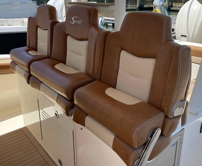 Shady Lady II Yacht Photos Pics Luxurious seating on 2019 Scout 380 LXF boat, featuring brown and beige leather upholstery.