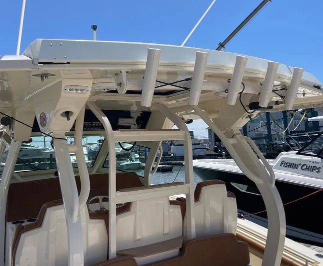 Shady Lady II Yacht Photos Pics 2019 Scout 380 LXF boat interior with rod holders and seating at marina.